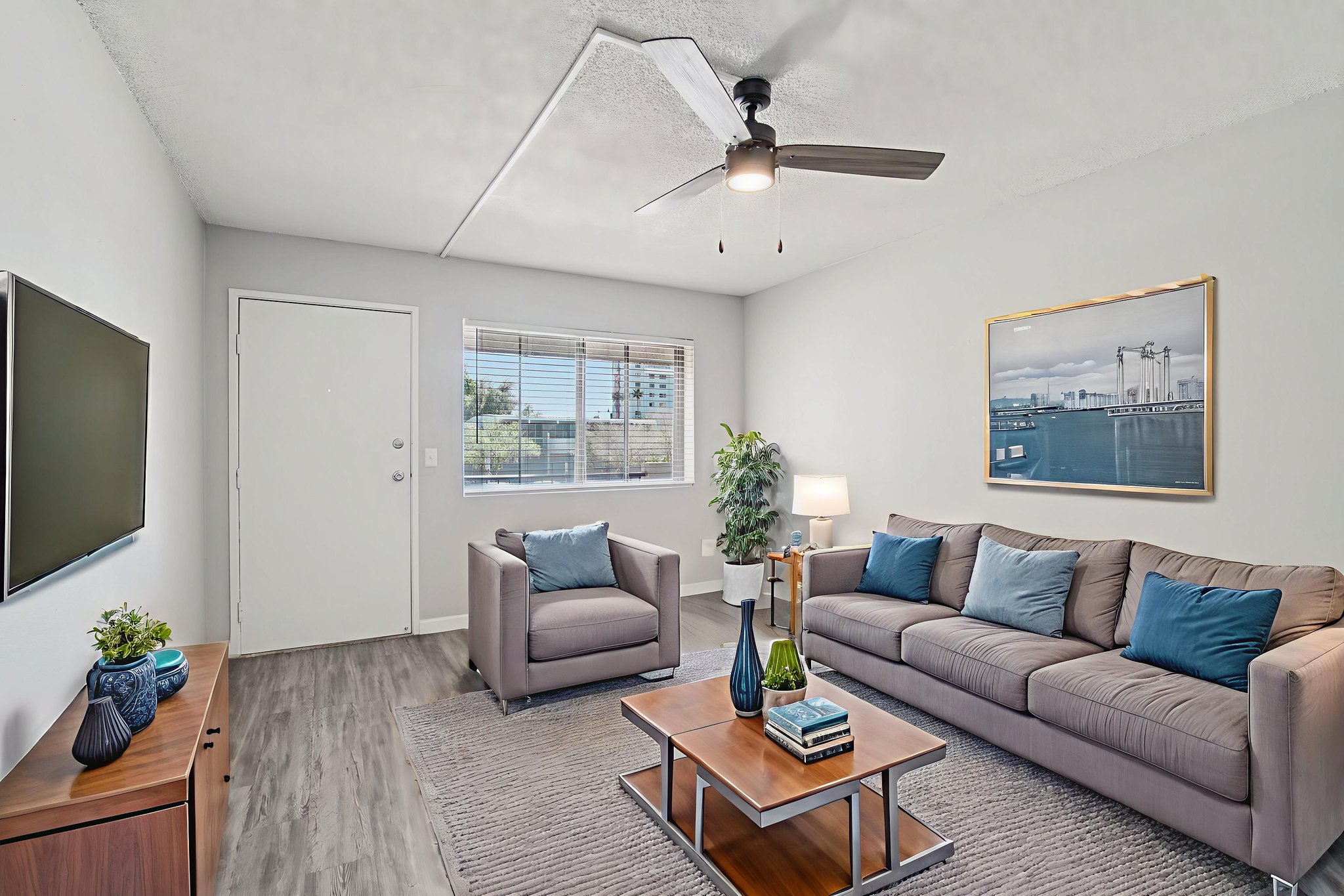Virtually staged living room with blue accent furniture