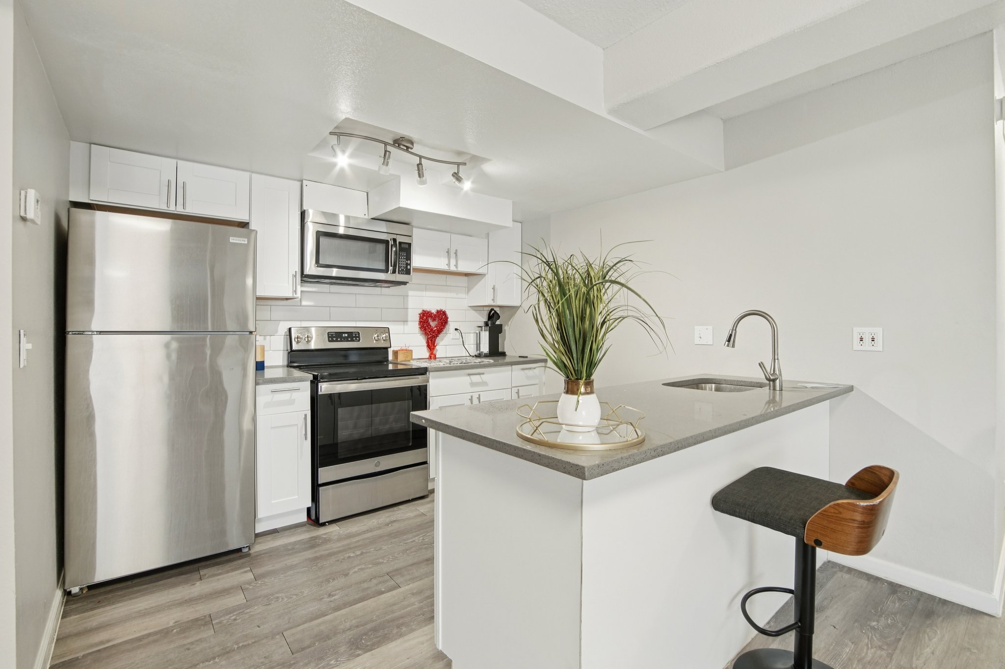 Spacious studio interior with breakfast bar and modern kitchen